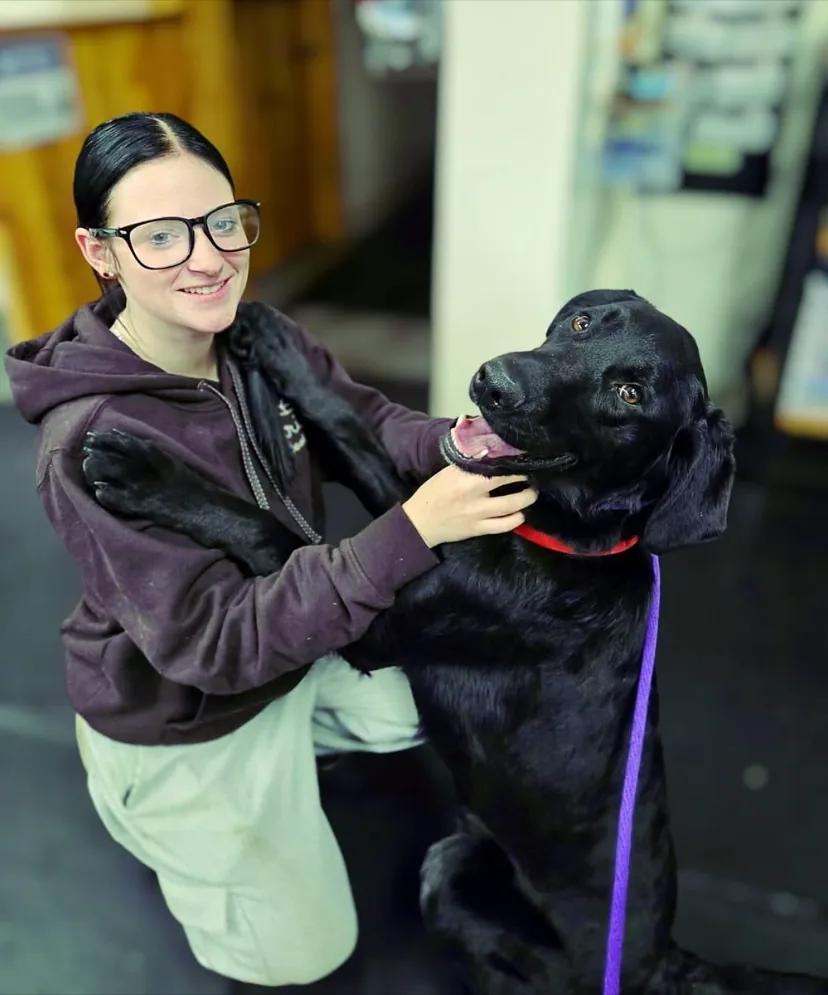 A Liberty K9 team member with a rescue dog